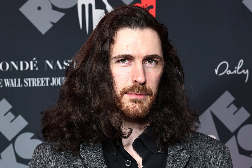 Hozier wears a grey suit on the red carpet