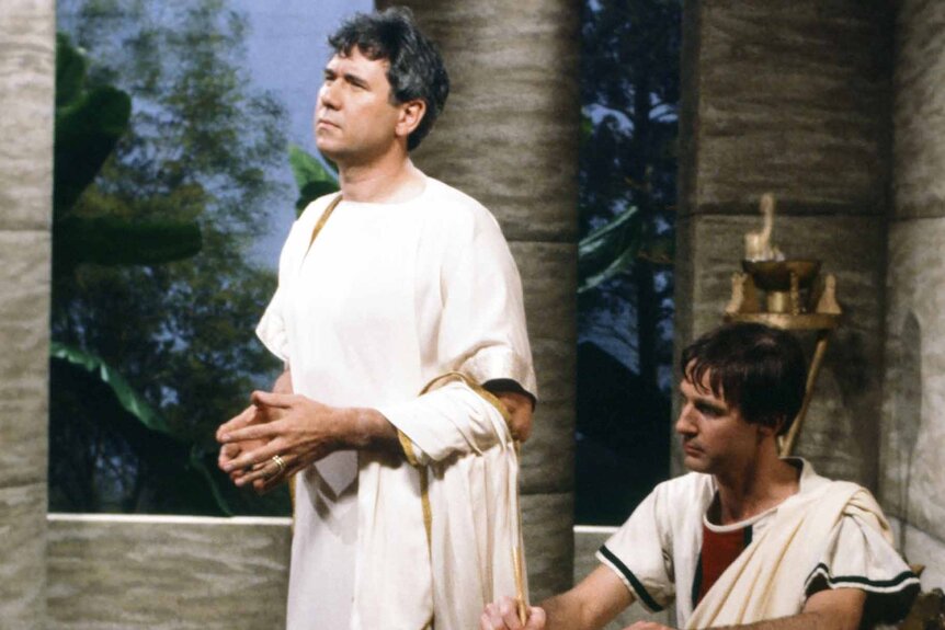 Kent Laxor (John Larroquette) and A. Whitney Brown are dressed as Roman senators during an SNL sketch.