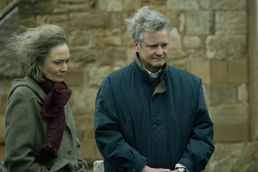 Jane Swire (Catherine McCormack) and Jim Swire (Colin Firth) stand in the wind in Lockerbie: A Search for Truth Episode 102.