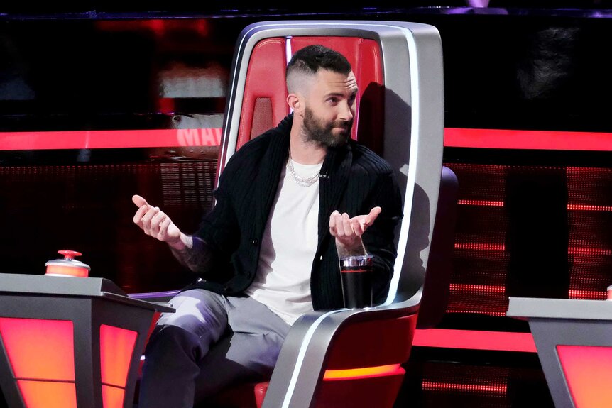 Adam Levine wears a black sweater and white shirt on The Voice Season 15 Episode 8.