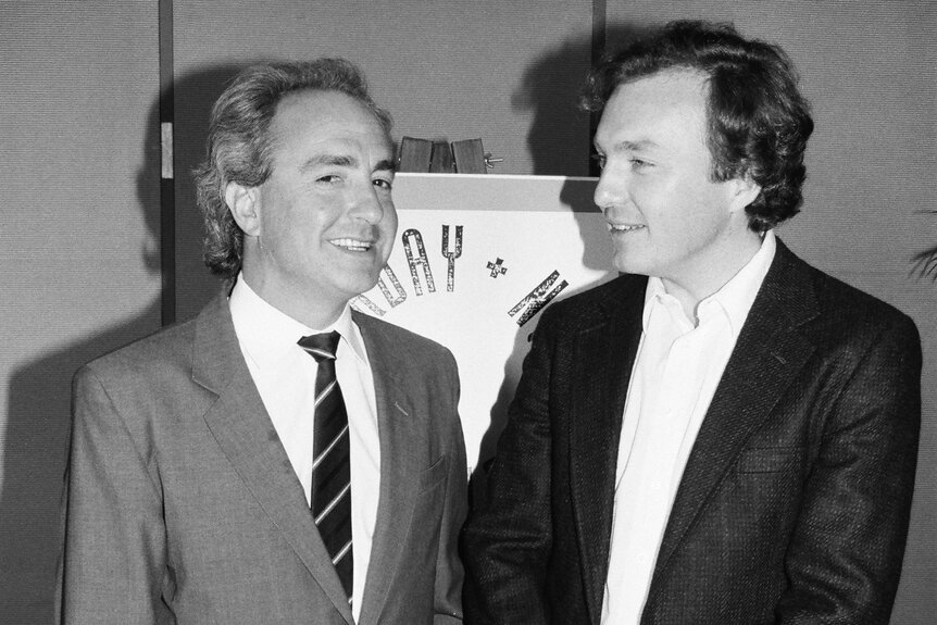 Lorne Michaels and Jim Downey speak to each other.