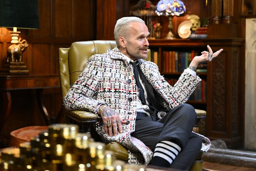 Bob Harper speaks in a tweed jacket on The Traitors Episode 301.