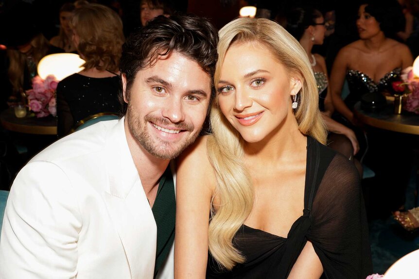 Kelsea Ballerini and boyfriend Chase Stokes smiling together at the 67th Annual Grammy Awards.