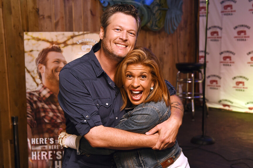 Blake Shelton and Hoda Kotb hug each other at karaoke bar WannaBs in 2017